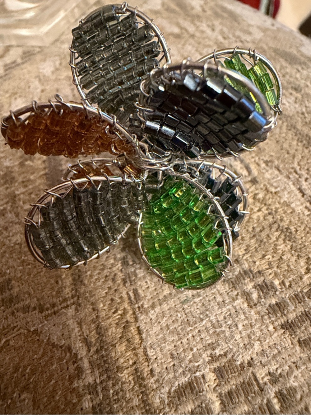Handcrafted seed bead Flower ringGreen, Amber, slate blue. Silver wire and band